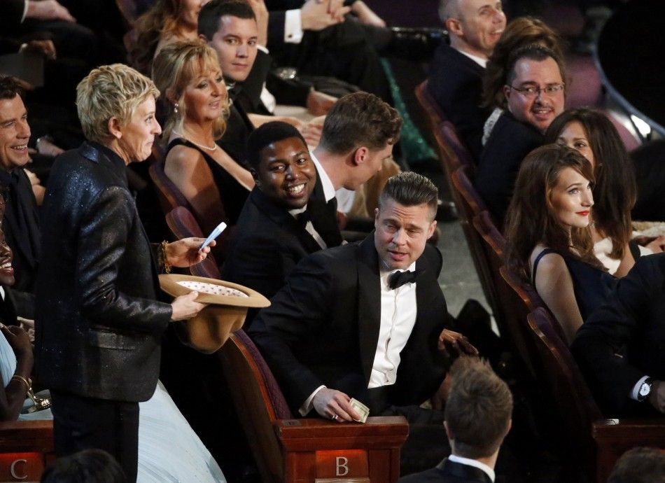 Show Host Ellen DeGeneres Collects Money for Pizza from the Audience at the 86th Academy Awards in Hollywood