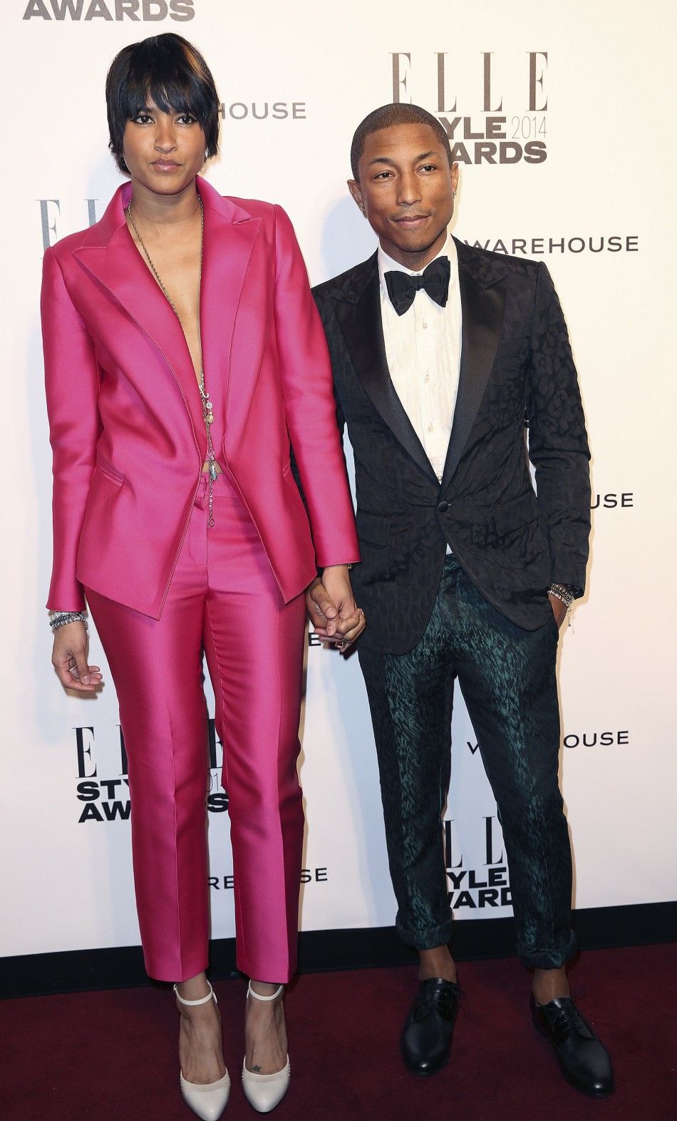 Singer Pharrell Williams and his wife Helen Lasichanh arrive at the Elle Style Awards in London