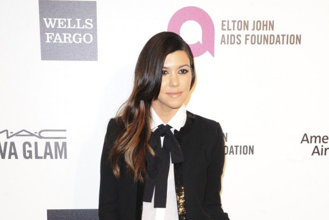Kourtney Kardashian arrives at the 2014 Elton John AIDS Foundation Oscar Party in West Hollywood