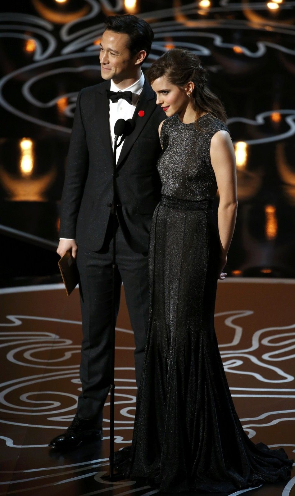 Actors Watson and Gordon-Levitt present the award for visual effects at the 86th Academy Awards in Hollywood