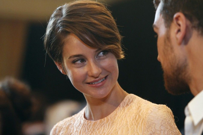 Cast members Theo James (R) and Shailene Woodley of the film &quot;Divergent&quot; 