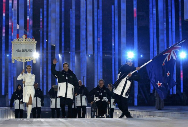New Zealand's flag-bearer Adam Hallflag (R), leads his country's contingent during the opening ceremony of the 2014 Paralympic Winter Games in Sochi, March 7, 2014.              REUTERS/Alexander Demianchuk