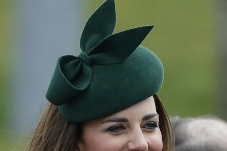 Britain's Catherine, Duchess of Cambridge wears a sprig of shamrock during a visit with her husband Prince William to the 1st Battalion Irish Guards for a St Patrick's Day Parade at Mons Barracks in Aldershot