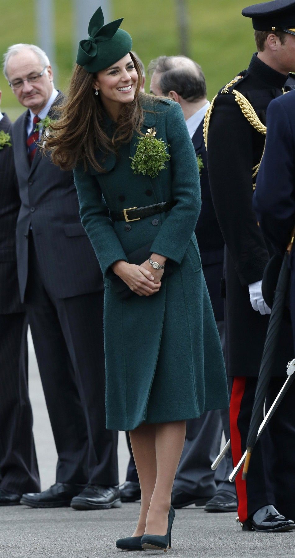 Britains Catherine, Duchess of Cambridge wears a sprig of shamrock during a visit with her husband Prince William to the 1st Battalion Irish Guards for a St Patricks Day Parade at Mons Barracks in Aldershot