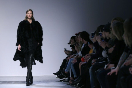 Model Karlie Kloss presents a creation by French designer Barbara Bui