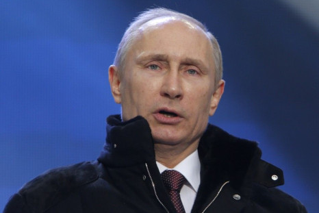 Putin addresses the audience during a rally and a concert called &quot;We are together&quot; in Moscow