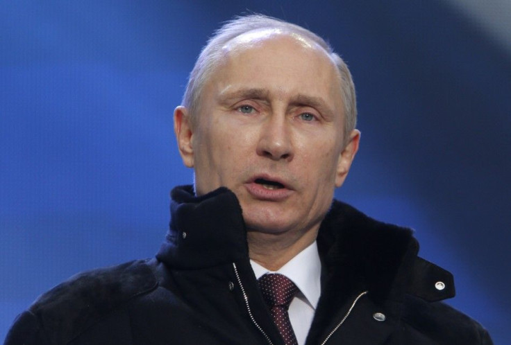 Putin addresses the audience during a rally and a concert called &quot;We are together&quot; in Moscow