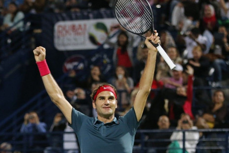 Roger Federer of Switzerland celebrates after defeating Tomas Berdych of Czech Republic in their men's singles final match at the ATP Dubai Tennis Championships, March 1, 2014.  REUTERS/Ahmed Jadallah