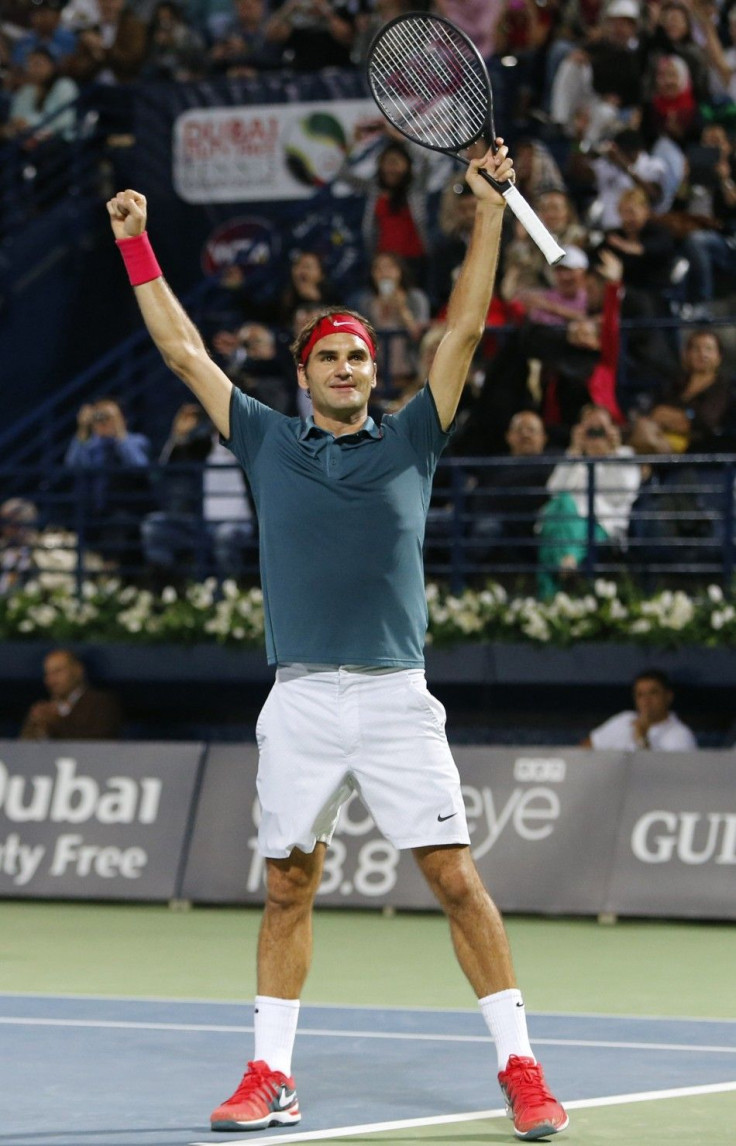 Roger Federer of Switzerland celebrates after defeating Tomas Berdych of Czech Republic in their men&#039;s singles final match at the ATP Dubai Tennis Championships, March 1, 2014.  REUTERS/Ahmed Jadallah