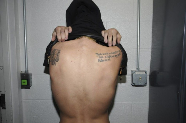 Handout of Canadian pop singer Justin Bieber showing a tattoo on his back while in police custody in Miami Beach, Florida