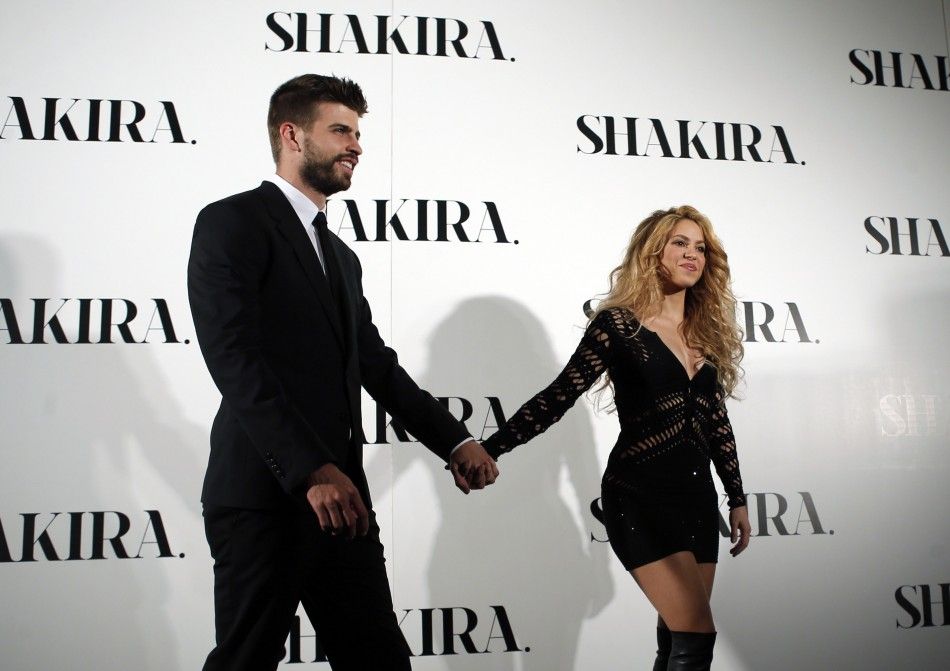 Colombian singer Shakira and Barcelonas soccer player Gerard Pique L pose during a photocall presenting her new album quotShakiraquot in Barcelona March 20, 2014. REUTERSAlbert Gea 