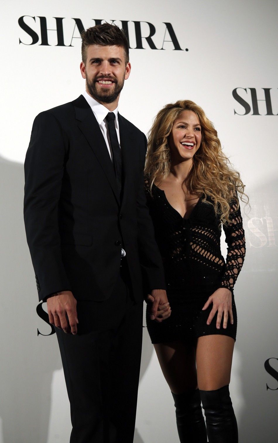 Colombian singer Shakira and Barcelonas soccer player Gerard Pique L pose during a photocall presenting her new album quotShakiraquot in Barcelona March 20, 2014. REUTERSAlbert Gea 