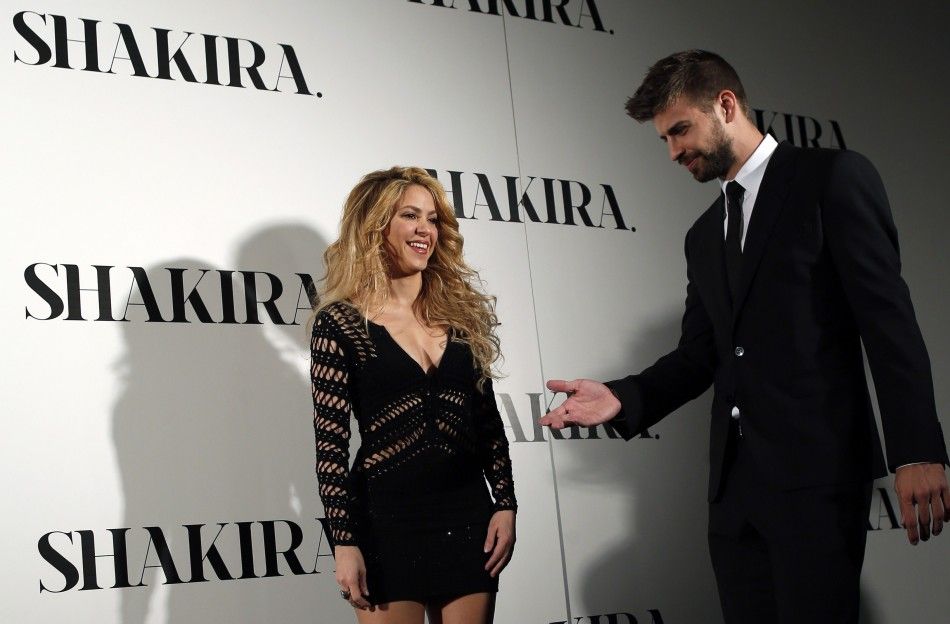 Colombian singer Shakira and Barcelonas soccer player Gerard Pique R pose during a photocall presenting her new album quotShakiraquot in Barcelona March 20, 2014. REUTERSAlbert Gea 