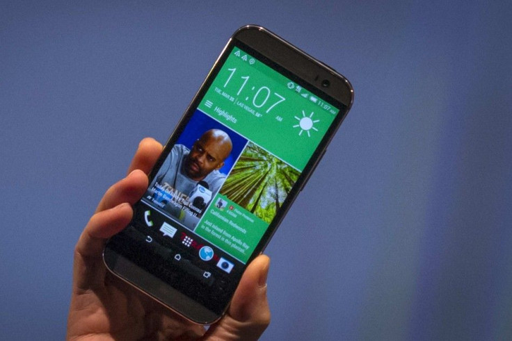Chou shows the new HTC One M8 phone during a launch event in New York
