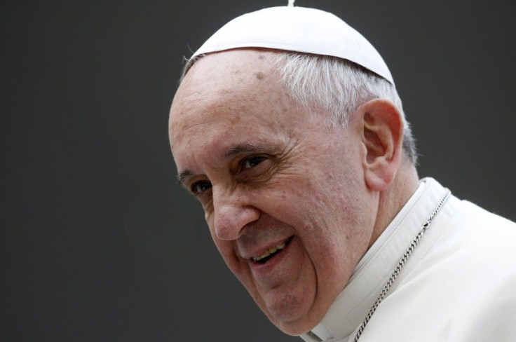 Pope Francis looks on during his Wednesday general audience in Saint Peter's Square at the Vatican in this March 19, 2014 file photo. Pope Francis on Saturday named a woman molested by a priest as a child to be part of a core group to help the Cathol
