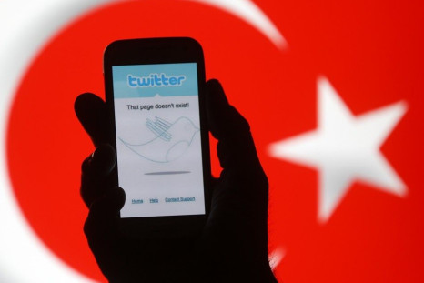 Person Holds a Samsung Galaxy S4 Displaying a Twitter Error Message in Front of Turkish National Flag in This Illustration Taken in Zenica
