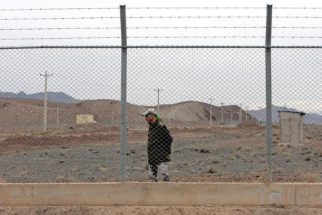 An Iranian soldier stands guard inside the Natanz uranium enrichment facility, 322km (200 miles) south of Iran's capital Tehran March 9, 2006. REUTERS/Raheb Homavandi