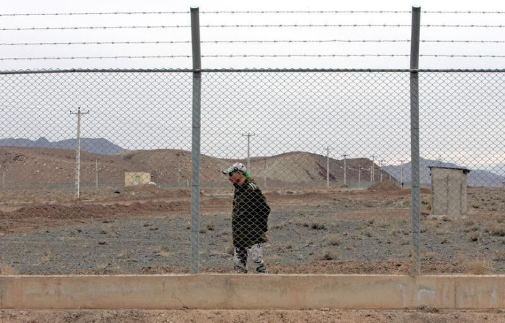 An Iranian soldier stands guard inside the Natanz uranium enrichment facility, 322km (200 miles) south of Iran's capital Tehran March 9, 2006. REUTERS/Raheb Homavandi