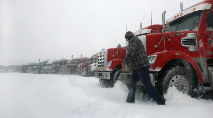 Darren Pittman - Transport truck driver Charles Fortin leaves his truck at a truck stop in Enfield Nova Scotia during a major storm
