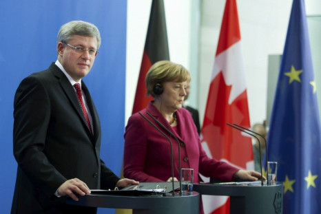 German Chancellor Merkel and Canadian Prime Minister Harper address joint news conference at Chancellery in Berlin