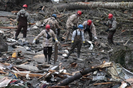 Workers search for victims in a massive mudslide in Oso, Washington
