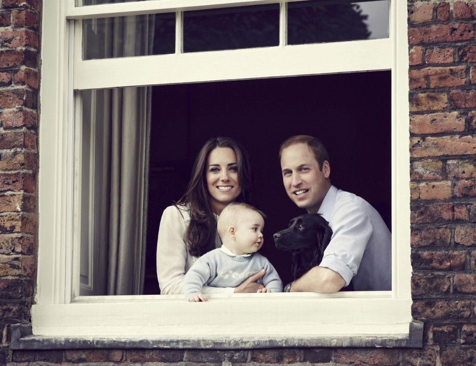 Britain039s Prince William, Catherine, Duchess of Cambridge and their son Prince George, are seen in this photograph taken in Kensington Palace, London