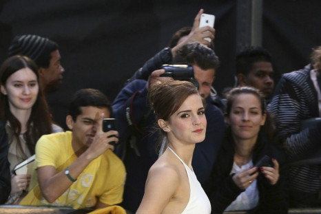 Emma Watson in Backless Ralph Lauren gown.