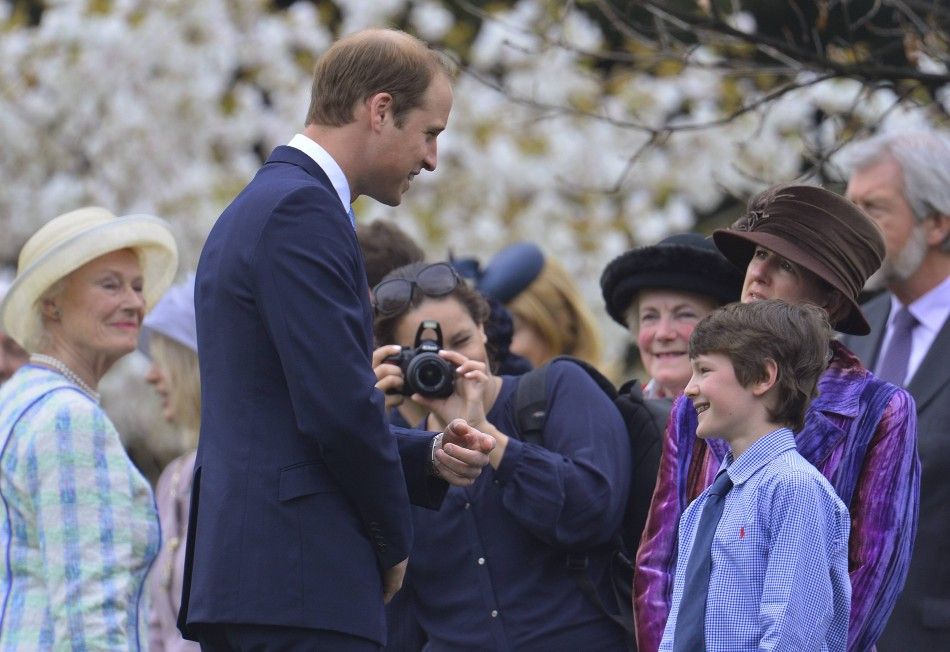 Britains Prince William, speaks to wellwishers as he attends the unveiling of the Windsor Greys statue in Windsor