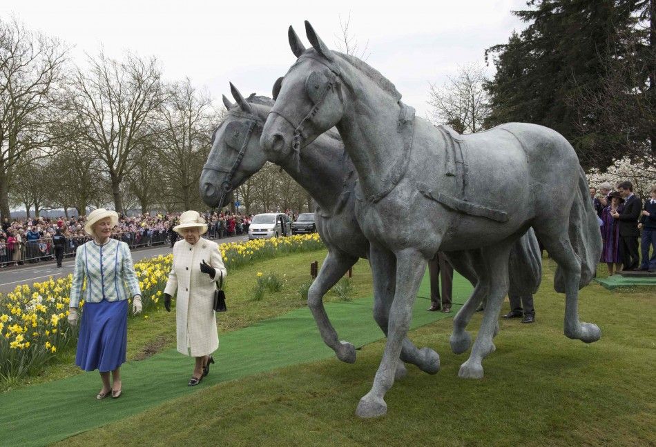 Britains Queen Elizabeth and Rosemary Ussher, chair of the Windsor Greys Jubilee Appeal, look on during the unveiling of the Windsor Greys statue in Windsor