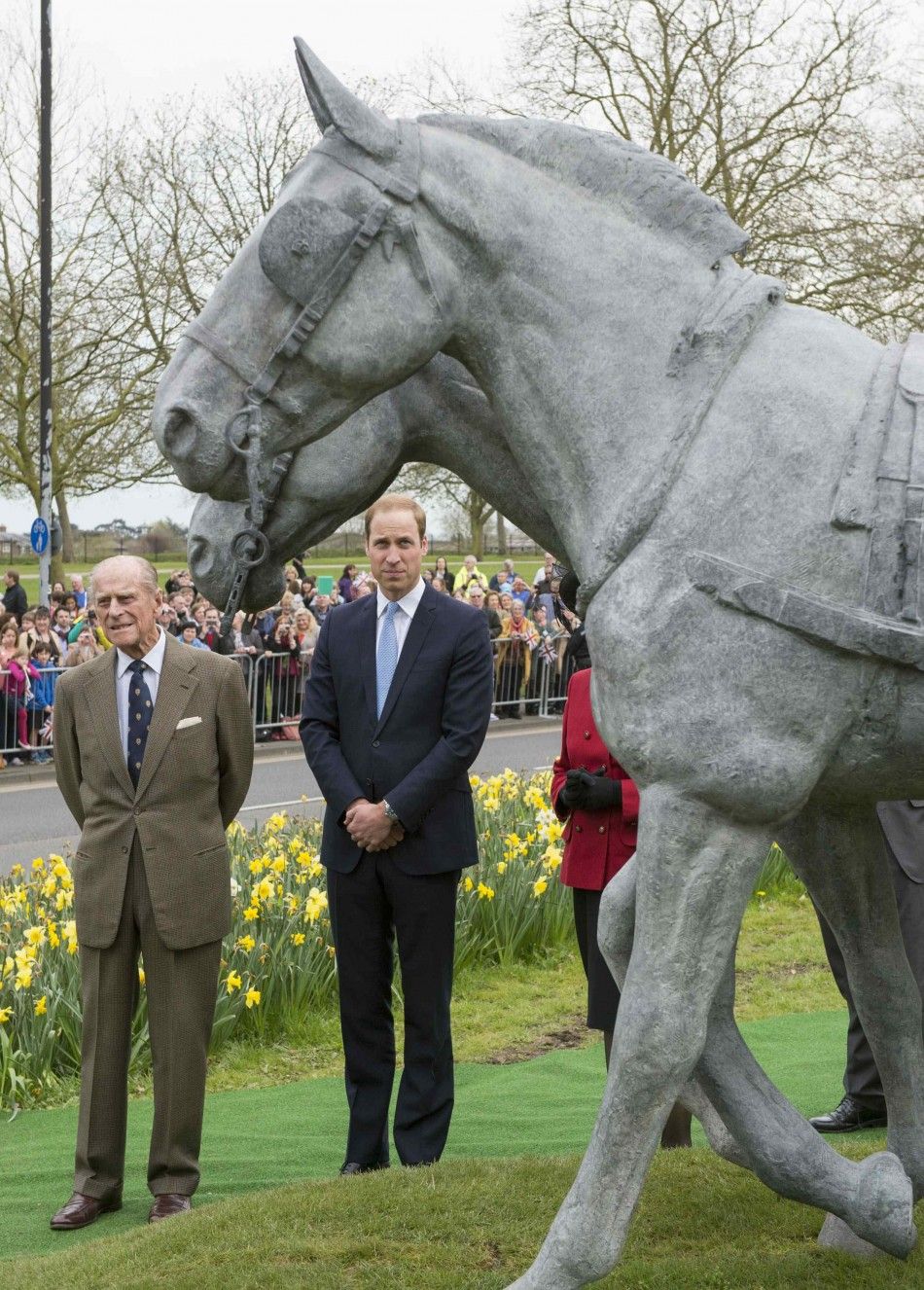 Britains Prince Philip and Prince William look on during unveiling of the Windsor Greys statue in Windsor, southern England