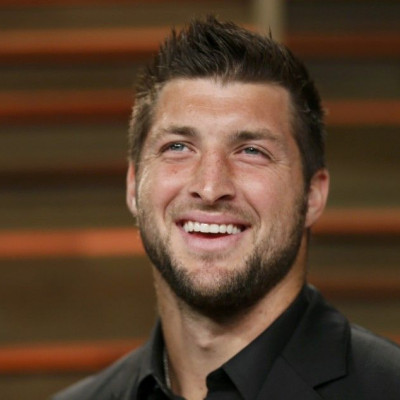 Former NFL player Tim Tebow arrives at the 2014 Vanity Fair Oscars Party in West Hollywood, California March 2, 2014. REUTERS/Danny Moloshok