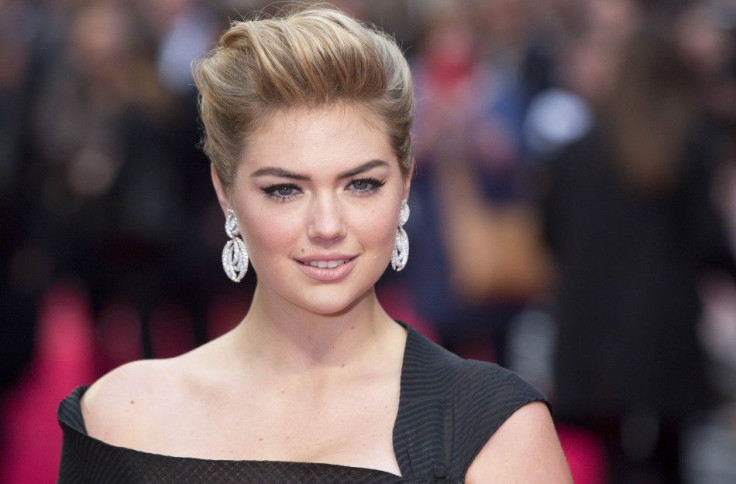Actress and model Kate Upton poses for photographers as she arrives for the UK Gala screening of The Other Woman in London