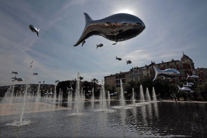 Fish-shaped balloons float above water fountains to mark April Fools Day, called &quot;Poisson d&#039;Avril&quot; in France, in the centre of Nice, April 1, 2014.  REUTERS/Eric Gaillard