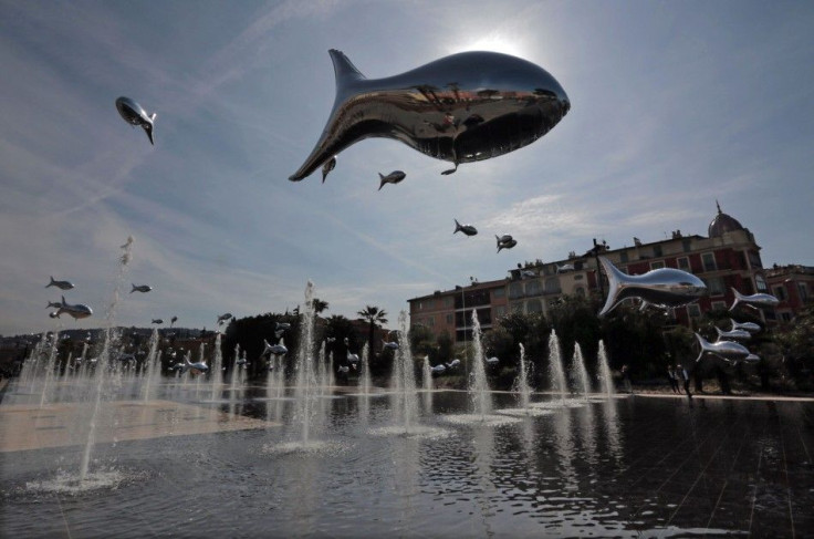 Fish-shaped balloons float above water fountains to mark April Fools Day, called &quot;Poisson d&#039;Avril&quot; in France, in the centre of Nice, April 1, 2014.  REUTERS/Eric Gaillard