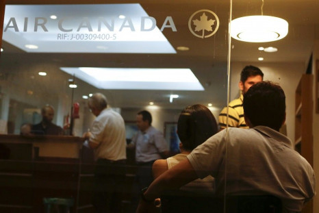 Customers wait their turn to be served at the Air Canada&#039;s office in Caracas
