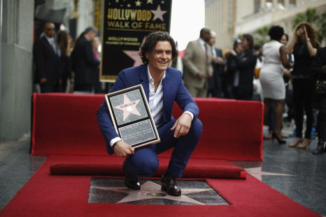 Actor Orlando Bloom of Britain watches as his son Flynn unveils his star on the Hollywood Walk of Fame in Hollywood, Los Angeles
