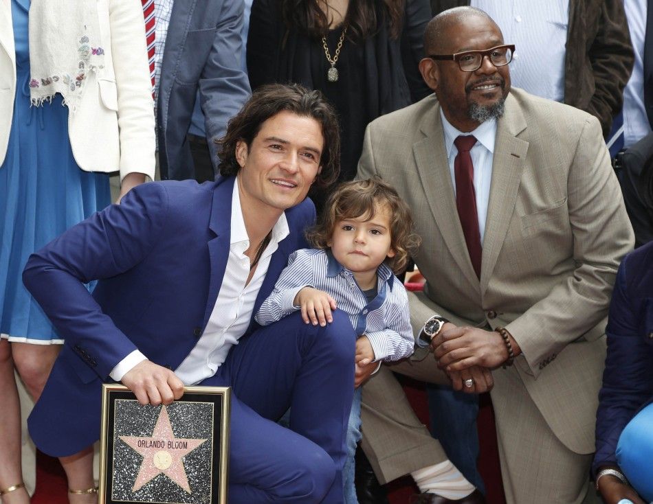 Actor Orlando Bloom of Britain poses on his star on the Hollywood Walk of Fame in Hollywood, Los Angeles