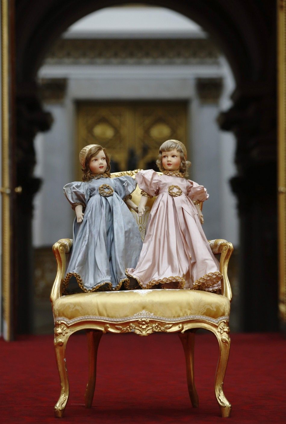 A pair of Parisian dolls belonging to Britains Queen Elizabeth and her sister Princess Margaret, are seen at Buckingham Palace in London