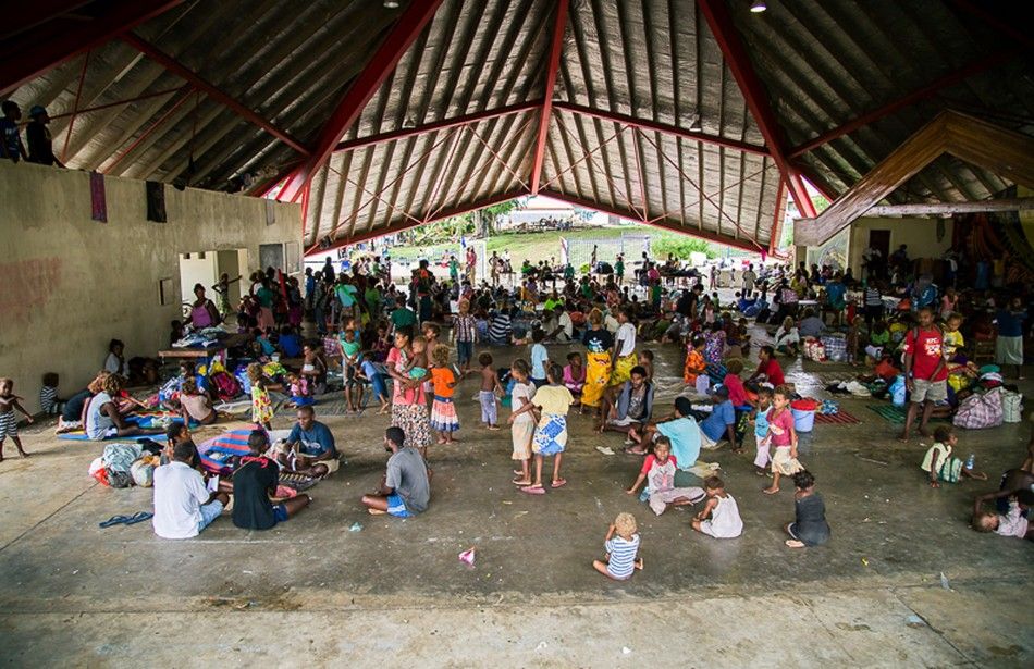 People can be seen at the Panatina Pavilion evacuation center after severe flooding in the capital Honiara in the Solomon Islands in this picture released by World Vision April 6, 2014. Local media reported that the United Nations Office for the Coordinat