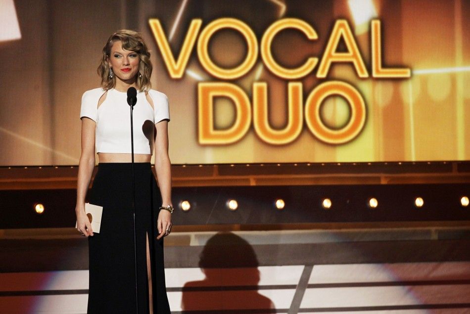 Taylor Swift presents the Vocal Duo of the Year Award on stage at the 49th Annual Academy of Country Music Awards in Las Vegas