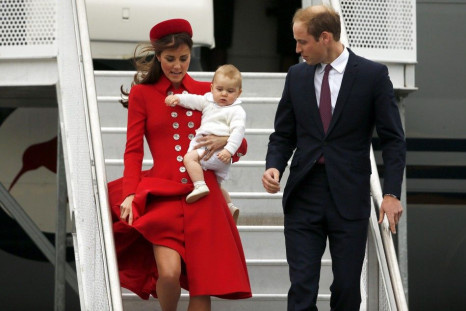 Britain's Prince William, his wife Catherine, Duchess of Cambridge, and their son Prince George disembark from their plane after arriving in Wellington