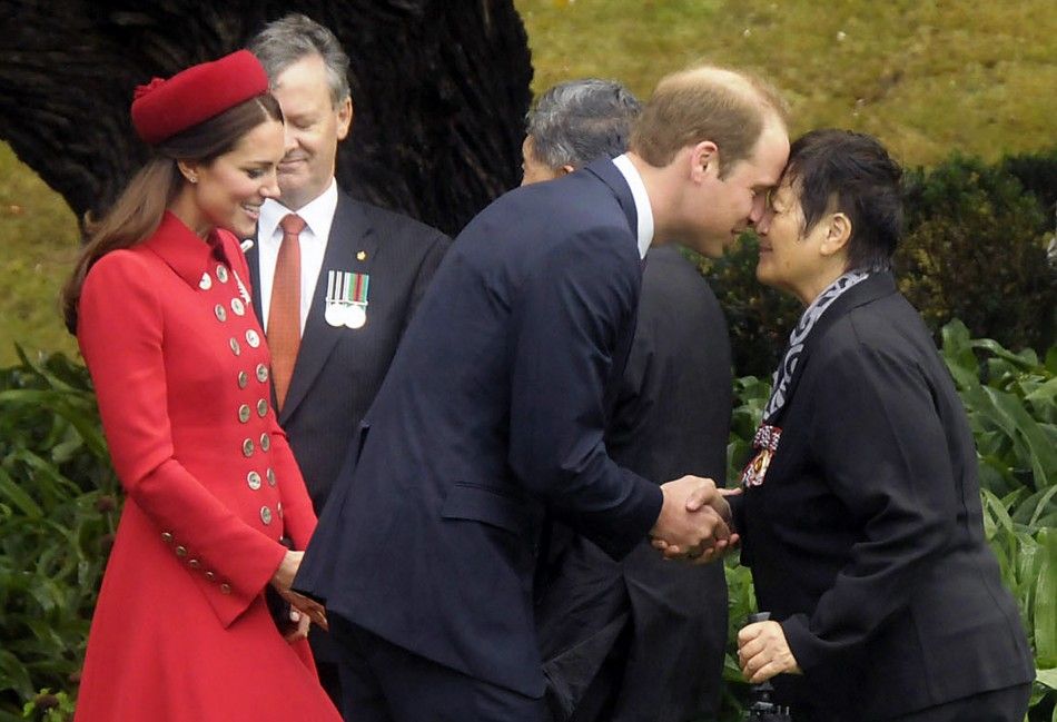 Britains Prince William C is watched by his wife Catherine, Duchess of Cambridge, as he receives a Maori welcome known as a quotHongiquot at a traditional Maori Powhiri Ceremonial Welcome at Government House in Wellington April 7, 2014 in this hand