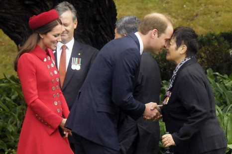 Britain's Prince William (C) is watched by his wife Catherine, Duchess of Cambridge, as he receives a Maori welcome known as a &quot;Hongi&quot; at a traditional Maori Powhiri Ceremonial Welcome at Government House in Wellington April 7, 2014 in this hand