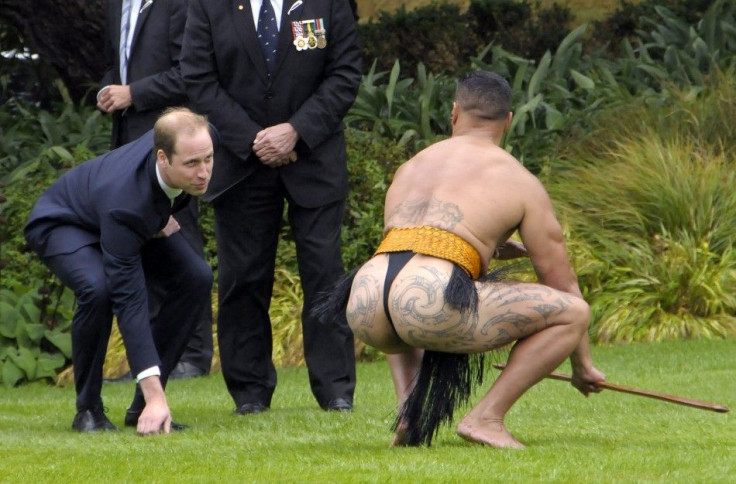 Britain's Prince William (L) picks up the &quot;rakau tapu&quot; as a man dressed as a Maori warrior looks on during a traditional Maori Powhiri Ceremonial Welcome at Government House in Wellington April 7, 2014 in this handout provided by Woolf Crown Cop