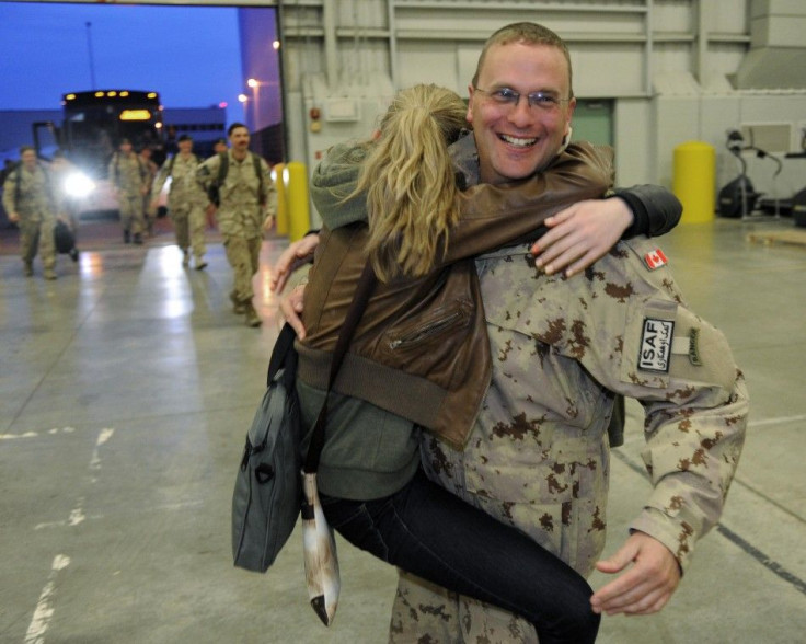 Lt.-Col Hammond receives a hug from his daughters as the last of Canada&#039;s troops return home from Afghanistan to Edmonton Garrison