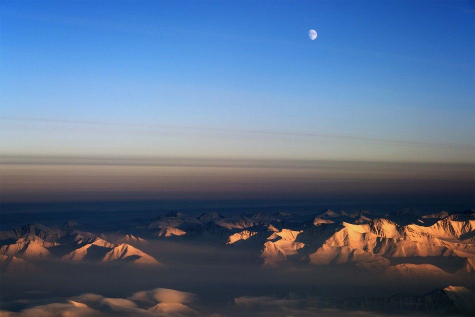 The moon is seen north of the Fram Strait in northeast Greenland
