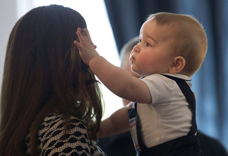 Catherine, Duchess of Cambridge, holds her son Prince George at Government House in Wellington