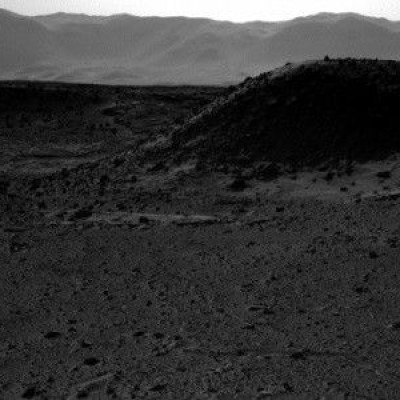 This image from NASA's Curiosity Mars rover, taken on April 3, 2014, includes a bright spot near the upper left corner. Possible explanations include a glint from a rock or a cosmic-ray hit. (NASA/JPL-Caltech)