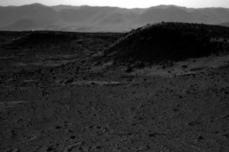 This image from NASA's Curiosity Mars rover, taken on April 3, 2014, includes a bright spot near the upper left corner. Possible explanations include a glint from a rock or a cosmic-ray hit. (NASA/JPL-Caltech)