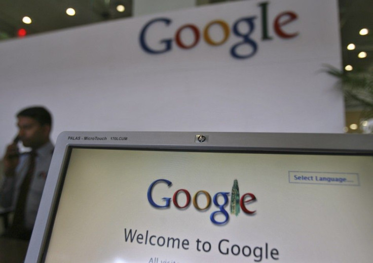 A Security Personnel Answers a Call at the Reception Counter of the Google Office in the Southern Indian City of Hyderabad